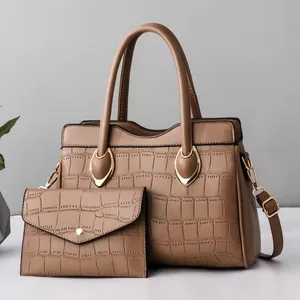 Brown crocodile embossed tote bag and matching clutch set with golden hardware
