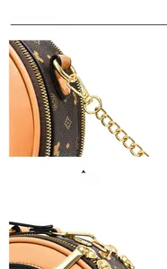 Détails de l'attache en métal doré et des coutures sur le sac bandoulière rond