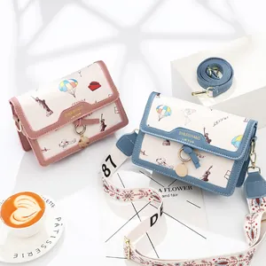Chic printed crossbody bags in pink and blue with artistic landmarks and wide strap