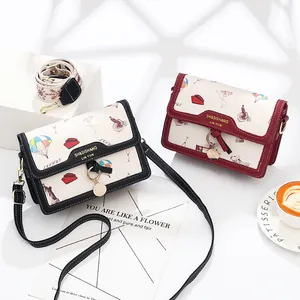 Floral print crossbody bags in black and burgundy with vintage travel patterns and two straps