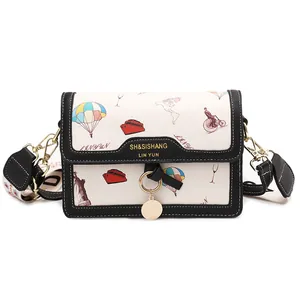Minimalist printed crossbody bag for women with colorful world map illustrations and wide strap