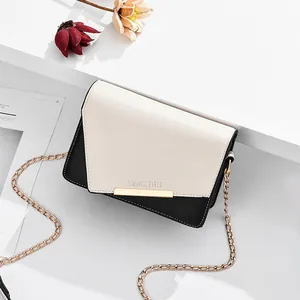 Bolso bandolera bicolor con cadena dorada e inscripción elegante Romantic Paris