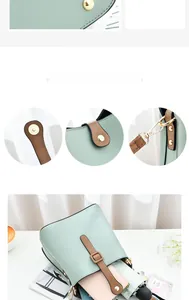 Detail view of mint green bucket bag showing magnetic closure and interior storage space