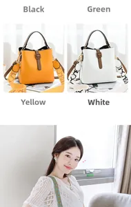 Detail view of stylish yellow bucket bag featuring a wide patterned strap and leather texture