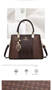 Macro detail of scratch-resistant brown leather texture and gold logo on the handbag