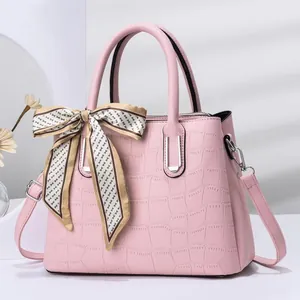 Pink faux leather handbag with crocodile pattern, silk scarf handle and shoulder strap