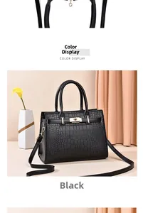 Dettaglio borsa nera trama coccodrillo con chiusura girevole dorata e decoro elegante