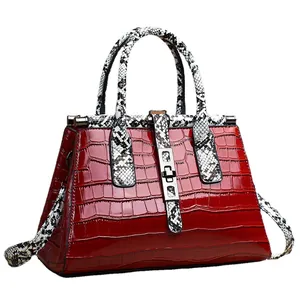 Deep red crocodile embossed leather tote bag with snakeskin pattern handles and silver lock