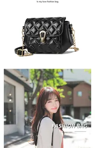 Detail of black quilted leather crossbody bag with golden chain and water drop metal lock