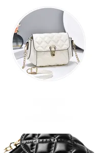 Detail of quilted crossbody bag featuring a shell-shaped metal clasp and chain strap