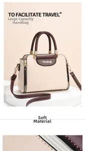 Close-up of litchi texture leather and metal logo on contrast color shoulder bag