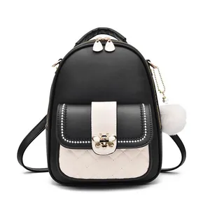 Fashionable bee-motif backpack with black and white contrast and quilted faux leather finish