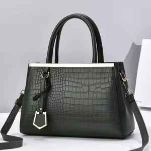 Dark green crocodile embossed leather tote bag with gold metal hardware for women