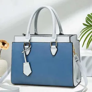 Women's color-block tote bag in dark and light blue PU leather with gold hardware