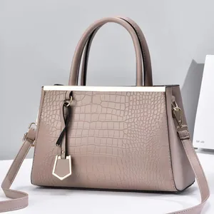 Taupe crocodile-embossed PU leather handbag with gold hardware and shoulder strap