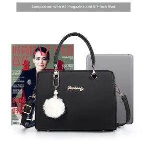 Size comparison of black tote bag with A4 magazine and 9.7 inch tablet screen