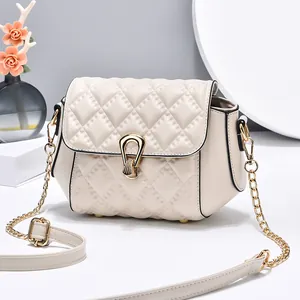 Elegant cream quilted chain crossbody bag with gold hardware and rhombic pattern texture