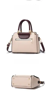 Detailed views of the dual-tone handbag showing side, back, and bottom metal studs