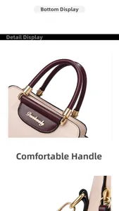 Detailed close-up of contrasting color faux leather handbag with golden logo and hardware