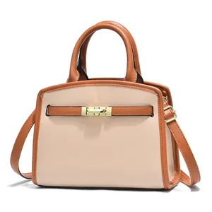 Elegante borsa a mano in pelle bicolore con finiture dorate, portabile a mano o a tracolla