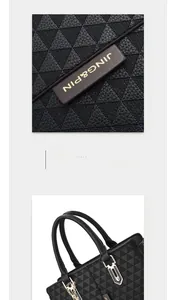 Detail of black tote bag featuring geometric triangle embossing and a gold brand plaque