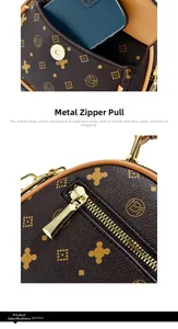 Detail of smooth metal zipper and magnetic snap on printed brown leather handbag