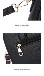 Close-up of golden hardware hook and zipper on black lychee grain leather handbag