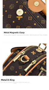 Detail of gold magnetic clasp and D-ring on brown printed leather crossbody bag