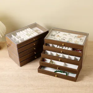 Walnut wood grain jewelry organizer with clear acrylic drawers and gold handles