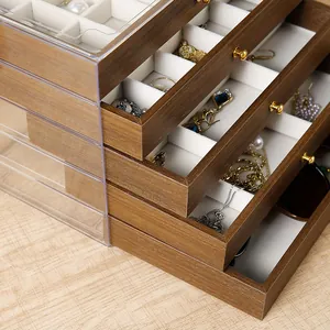 Detail of walnut wood jewelry box with multi-layer drawers and soft velvet lining