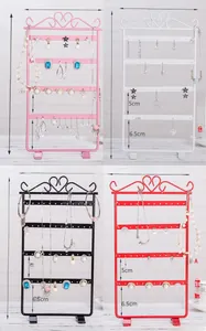 Detail view of 48-hole iron earring display stand in pink, white, black and red colors