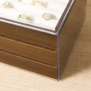Detailed view of walnut jewelry box with multi-layer drawers and soft velvet ring slots