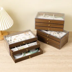 Three-layer walnut wood grain jewelry box with transparent lid and golden pull handles