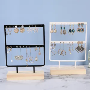 Black and white iron earring display stands with wood base for jewelry organization