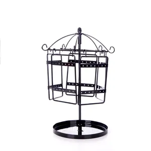 Rotating black metal jewelry stand with multi-layer mesh grid and round storage base
