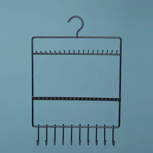 Black metal jewelry organizer rack with hooks for hanging earrings and necklaces
