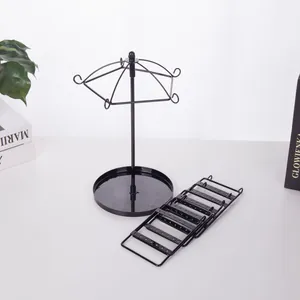 Rotating black metal jewelry stand set with umbrella hooks and earring display panels