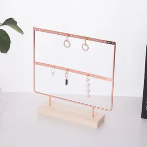 Zweistöckiger roségoldener Ohrringständer mit Metallrahmen und Holzsockel für Schmuck