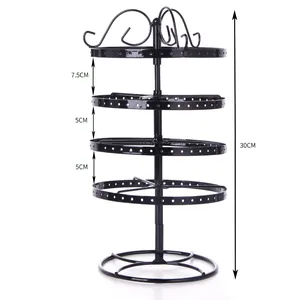 Rotating 4-tier black metal earring stand with size marks on a clean white background