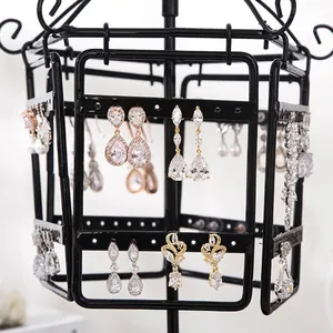 Rotating black metal earring organizer stand with multi-tier birdcage design for jewelry