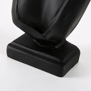 Modern matte black resin jewelry display stand with a stable rectangular base for necklaces