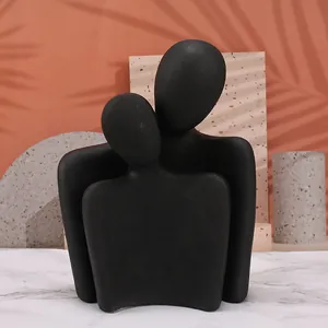 Detail view of modern matte black abstract resin sculpture with textured finish