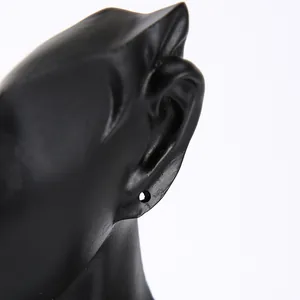 Detail of matte black mannequin head side profile for earring and jewelry display