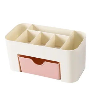 Minimalist desktop cosmetic organizer with pink drawer and multi-slot storage compartments