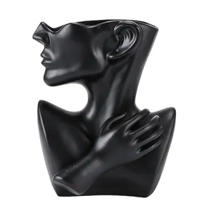 Modern matte black creative portrait sculpture vase for artistic floral arrangements