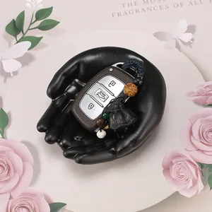 Creative black matte hand-shaped resin tray for jewelry and key storage home decoration