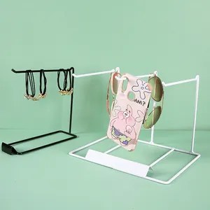 Minimalist black and white iron jewelry display stands for headbands and necklaces