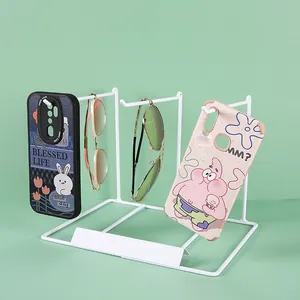 White metal jewelry display rack with minimalist wire frame for earrings and necklaces