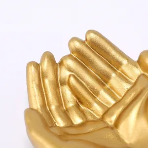 Golden resin hand-shaped jewelry holder and decorative display stand for rings and necklaces