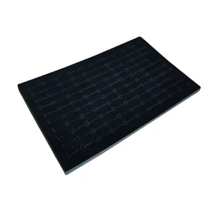 Black rectangular foam jewelry display insert with multiple H-slots for rings and earrings